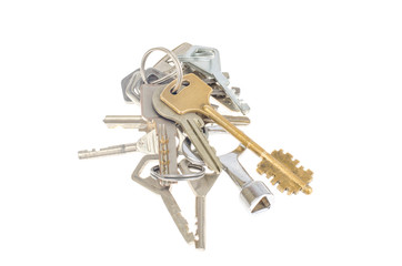 Bundles of old keys on white background.