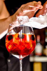 Cocktail aperol spritz in a glass glass glass is on the table