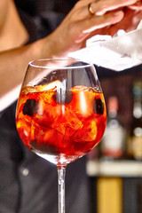 Cocktail aperol spritz in a glass glass glass is on the table