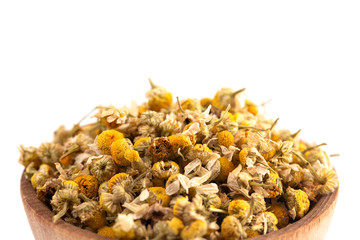Bowl of Dried Chamomile Flowers Isolated on a White Background