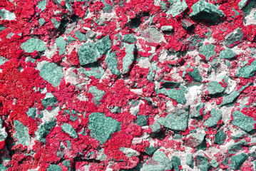 Cracked red paint, plaster surface  with crushed stones on wall, grunge horizontal shabby...