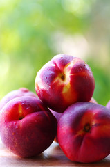peaches in closeup, green background