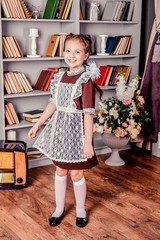 schoolgirl in soviet school uniform. portrait of a young schoolgirl. girl in school uniform. girl...