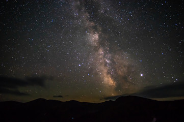 Starry sky at night over the mountains in the Carpathians