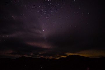 Starry sky at night over the mountains in the Carpathians