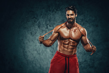 Handsome Athletic Man Posing With Jump , Skipping Rope