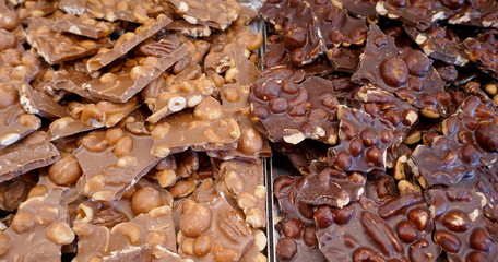 Homemade chocolate bars,light and dark, two varieties with many different nuts