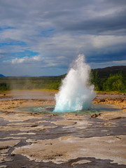 Strokkur geyser beginning to erupt at Geysir, Iceland