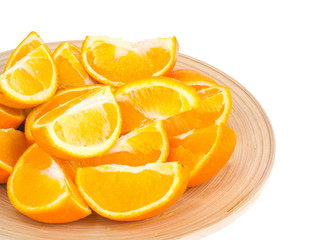 Fototapeta na wymiar Wooden dish with juicy sliced orange isolated on white background.