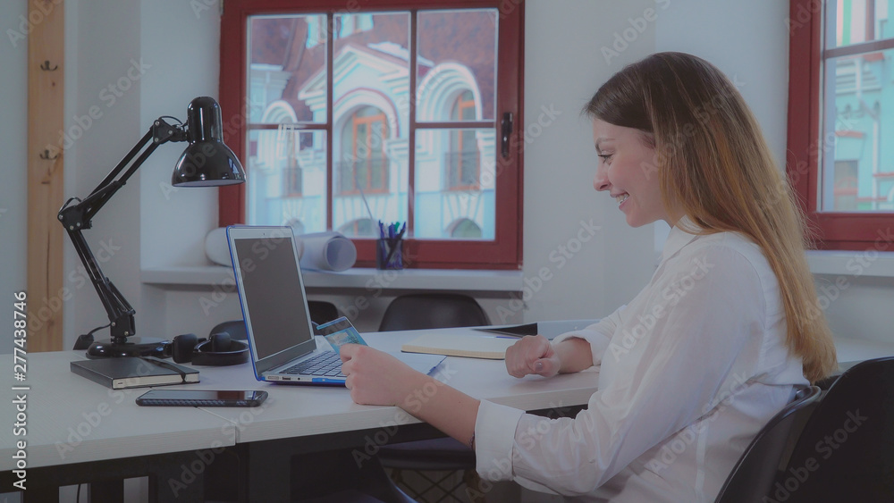Poster young caucasian architect working in creative office. professional designer sitting the the table wi