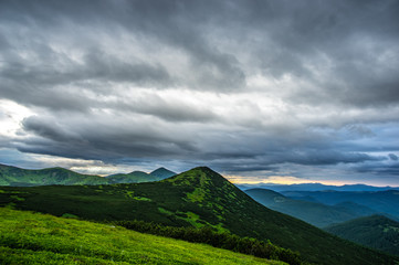 Rain clouds in the evening over the mountains
