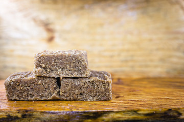 boy foot, ground peanut candy typical of Brazil, state of Minas Gerais. Sweet of June party, made in the city of piranguinho. Copy Space for text.