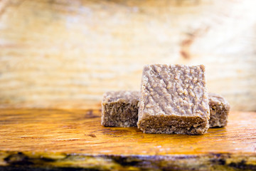 boy foot, ground peanut candy typical of Brazil, state of Minas Gerais. Sweet of June party, made in the city of piranguinho. Copy Space for text.