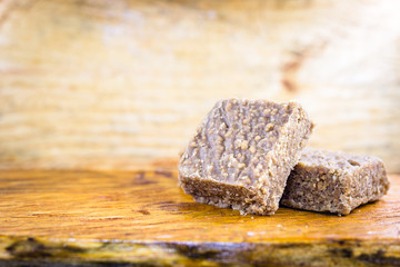 boy foot, ground peanut candy typical of Brazil, state of Minas Gerais. Sweet of June party, made in the city of piranguinho. Copy Space for text.