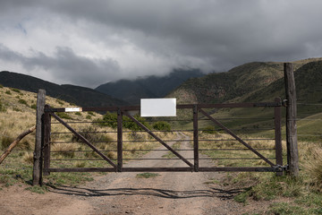 Fototapeta na wymiar A farm gate to the mountains