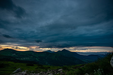 Sunset in the clouds over the Carpathian Mountains
