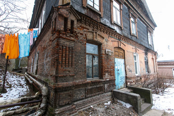 Fototapeta na wymiar The ensemble of historic wooden houses in the center of Vladivostok. Historical Foundation.