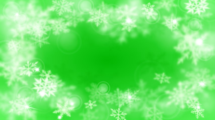 Christmas blurred background with frame of complex defocused big and small snowflakes in green colors with bokeh effect