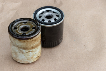 Old and new oil filter. There is a copy space for inscriptions on the engine oil change.