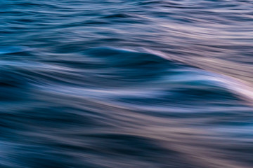 Gentle soothing silky flowing natural ocean water movement. Abstract background motion blur. Serene...