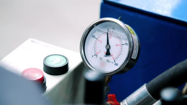 Closeup of manometer working in workshop. Industrial measuring equipment
