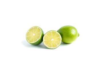 Lime whole and two half isolated on white background