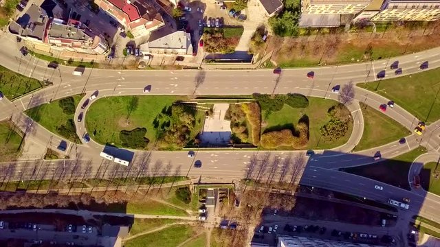 Top aerial view of traffic on elliptical road static