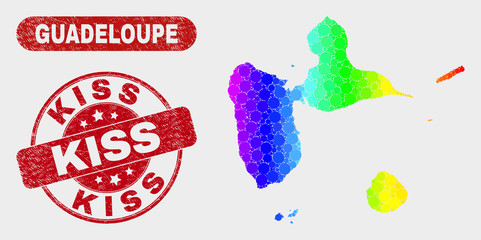 Rainbow colored dotted Guadeloupe map and watermarks. Red rounded Kiss scratched stamp. Gradiented rainbow colored Guadeloupe map mosaic of scattered circle dots. Kiss seal stamp with grunge surface.