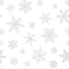 Christmas seamless pattern of complex big and small snowflakes in gray colors on white background