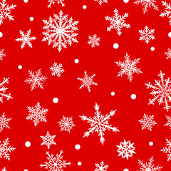 Christmas seamless pattern of complex big and small snowflakes in white colors on red background