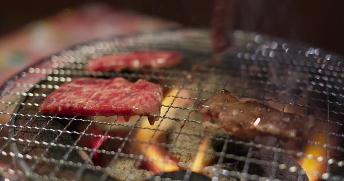 Japanese barbecue in the restaurant, grill wagyu on metal net