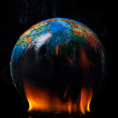 Planet Earth on a black background in the fire