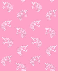 Vector seamless pattern of hand drawn sketch doodle unicorn head isolated on pink background