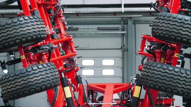 Trailed cultivator with thick tire unfolding. Agricultural machinery with wheels