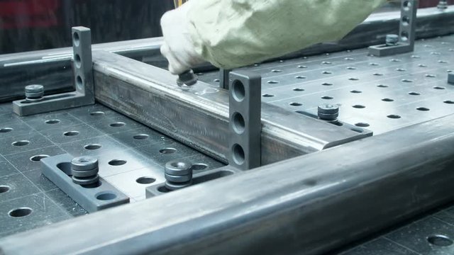 Metal blank is fixed on special machine. Work in metalworking work shop