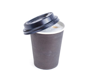Disposable black paper cup with cappuccino, latte. 