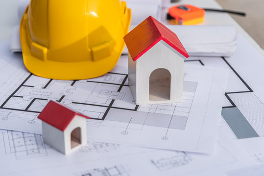 Architect Desk With Blueprint And Hard Hat Constuction Building.