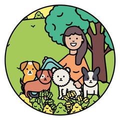 young woman with little dogs in the park