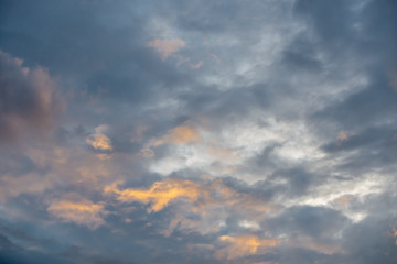 Fototapeta premium The cloudscape photo after the sunset with two tones of clouds in the evening after the rain. 