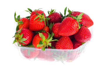 Fresh sweet red strawberries in plastic container. 
