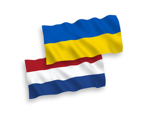 National vector fabric wave flags of Netherlands and Ukraine isolated on white background. 1 to 2 proportion.