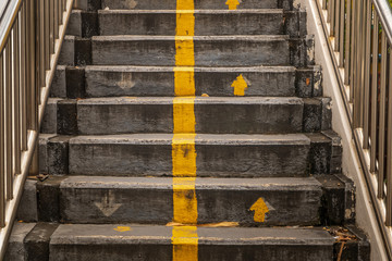 Stairs, walkway to pedestrian overpass leading down.