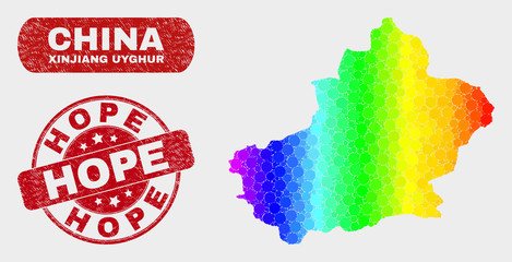 Rainbow colored dotted Xinjiang Uyghur Region map and stamps. Red round Hope textured watermark. Gradiented rainbow colored Xinjiang Uyghur Region map mosaic of random round dots.