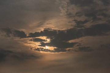 In the evening, the dark clouds cover the sunlight and show a brilliant orange glow.