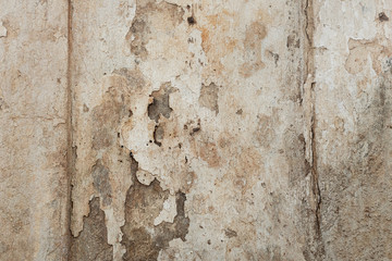 Texture of a concrete wall with cracks and scratches which can be used as a background