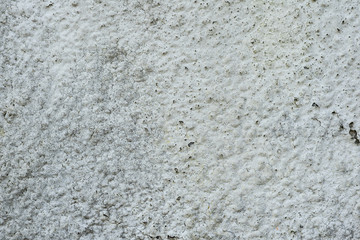 Texture of a concrete wall with cracks and scratches which can be used as a background