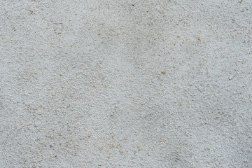 Texture of a concrete wall with cracks and scratches which can be used as a background