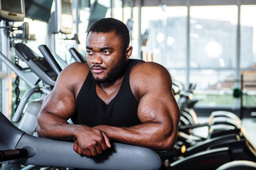 Fototapeta na wymiar Male athlete, bodybuilder, working out in the gym.