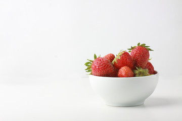 a bowl of strawbery isolated on white background