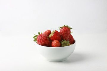 a bowl of strawbery isolated on white background